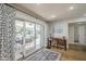 Bright bedroom with patio access, desk area, and neutral-toned decor at 7471 E Northern Ave, Scottsdale, AZ 85258