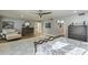 Relaxing bedroom with wood floors, ceiling fan, sitting area, and comfortable blue and white bedding at 7471 E Northern Ave, Scottsdale, AZ 85258