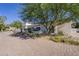 Attractive home exterior with well-maintained desert landscaping and a paved brick driveway at 7471 E Northern Ave, Scottsdale, AZ 85258
