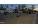 Professionally landscaped front yard showcasing desert landscaping and beautiful trees at 7471 E Northern Ave, Scottsdale, AZ 85258