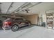 Clean, organized garage with ample storage and a stylish SUV parked inside on the epoxy floors at 7471 E Northern Ave, Scottsdale, AZ 85258