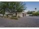 Desert home with paver driveway, two-car garage, and xeriscaped landscaping for easy upkeep at 7471 E Northern Ave, Scottsdale, AZ 85258