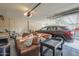 Organized garage with ample storage, including cabinets, shelving, and a comfortable leather sofa at 7471 E Northern Ave, Scottsdale, AZ 85258