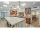 Spacious kitchen featuring a large island with granite countertops, skylights, and custom cabinetry at 7471 E Northern Ave, Scottsdale, AZ 85258