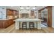 The kitchen features custom cabinetry, a large island, and stainless steel appliances at 7471 E Northern Ave, Scottsdale, AZ 85258