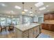 Bright kitchen with large island, stainless steel appliances, skylights and adjacent breakfast nook at 7471 E Northern Ave, Scottsdale, AZ 85258