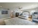 Large main bedroom with treadmill, ceiling fan, and French doors to outside at 7471 E Northern Ave, Scottsdale, AZ 85258