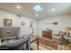 Comfortable office with natural light, hardwood floors, a cozy chair and side table at 7471 E Northern Ave, Scottsdale, AZ 85258