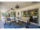 Inviting covered patio with stylish furniture, ceiling fans, and serene backyard views at 7471 E Northern Ave, Scottsdale, AZ 85258