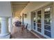 Inviting outdoor patio with tiled flooring, comfortable seating, and views of the lush surroundings at 7471 E Northern Ave, Scottsdale, AZ 85258