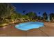 Beautiful pool at night, featuring elegant landscaping and ample space for relaxation and recreation at 7471 E Northern Ave, Scottsdale, AZ 85258