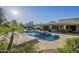 Resort-style backyard with swimming pool, patio, and mature landscaping at 7471 E Northern Ave, Scottsdale, AZ 85258