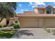Charming two-story home with a spacious two car garage and a beautiful fountain out front at 7760 E Pepper Tree Ln, Scottsdale, AZ 85250