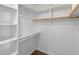 This walk-in closet has built-in shelving and space for organizing clothes and personal items at 7760 E Pepper Tree Ln, Scottsdale, AZ 85250