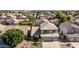 Bird's eye view of a two-story home with a well-manicured lawn in a residential neighborhood at 7931 W Harmony Ln, Peoria, AZ 85382