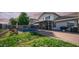 Backyard view featuring a fenced pool area, covered patio, and grassy lawn, ideal for leisure and recreation at 7931 W Harmony Ln, Peoria, AZ 85382