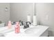 Powder room features a white vanity and decorative accents at 7931 W Harmony Ln, Peoria, AZ 85382