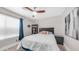 Bedroom featuring a ceiling fan and a black bookcase at 7931 W Harmony Ln, Peoria, AZ 85382