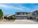 Charming two-story home featuring a well-manicured lawn, palm tree, and a convenient two-car garage at 7931 W Harmony Ln, Peoria, AZ 85382