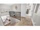Hallway features black railing, carpeted floors, and a view of the downstairs living area at 7931 W Harmony Ln, Peoria, AZ 85382
