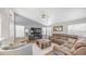 Spacious living room with gray shiplap accent wall and recessed lighting at 7931 W Harmony Ln, Peoria, AZ 85382