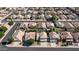 Aerial view of a suburban neighborhood featuring well-maintained homes and tree-lined streets at 7931 W Harmony Ln, Peoria, AZ 85382