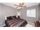 Bedroom with a ceiling fan and window at 8341 W Gross Ave, Tolleson, AZ 85353