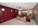 Main bedroom featuring a ceiling fan, carpet, and two bedside tables with lamps at 8341 W Gross Ave, Tolleson, AZ 85353
