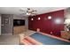 Spacious bedroom with a large bed, ceiling fan, and dresser at 8341 W Gross Ave, Tolleson, AZ 85353