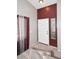 Entryway featuring a white door, tile flooring, and burgundy accent wall at 8341 W Gross Ave, Tolleson, AZ 85353