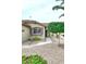 Front exterior featuring desert landscaping, a walkway to the entrance and an arched window with shutters at 8341 W Gross Ave, Tolleson, AZ 85353