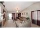 Bright living room with vaulted ceilings, sliding glass door, chandelier and neutral paint at 8341 W Gross Ave, Tolleson, AZ 85353