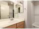 Bathroom vanity and shower area with clean fixtures and a well-lit mirror at 860 N Mcqueen Rd # 1157, Chandler, AZ 85225