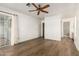 The spacious bedroom features new flooring and a sliding glass door to the patio at 860 N Mcqueen Rd # 1157, Chandler, AZ 85225