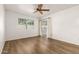 Cozy bedroom with new floors, ceiling fan, a bright window and sliding door to the patio at 860 N Mcqueen Rd # 1157, Chandler, AZ 85225