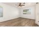 Bright bedroom with new flooring, a ceiling fan, and multiple windows at 860 N Mcqueen Rd # 1157, Chandler, AZ 85225