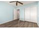 Spacious bedroom with closet, blue walls and ceiling fan provides a comfortable retreat at 860 N Mcqueen Rd # 1157, Chandler, AZ 85225