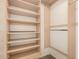 Spacious walk-in closet features custom shelving and ample hanging space for organization at 860 N Mcqueen Rd # 1157, Chandler, AZ 85225