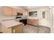 Well-lit kitchen boasts ample counter space, wood cabinets, and matching appliances at 860 N Mcqueen Rd # 1157, Chandler, AZ 85225