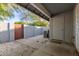 Enclosed patio with neutral gravel, masonry wall, and access door for relaxation at 860 N Mcqueen Rd # 1157, Chandler, AZ 85225