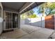 Outdoor patio with sliding glass doors, masonry wall, and gravel landscaping for easy maintenance at 860 N Mcqueen Rd # 1157, Chandler, AZ 85225