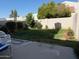 View of backyard, featuring grass, plants and hardscape at 9060 N 47Th Ln, Glendale, AZ 85302