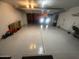 Clean, well-lit garage with epoxy flooring, providing ample parking and storage space at 9060 N 47Th Ln, Glendale, AZ 85302