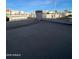 Flat roof with fencing on a sunny day, offering potential outdoor space and views at 9060 N 47Th Ln, Glendale, AZ 85302