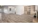 Large living space featuring an open floor plan, fireplace, and built-in shelving at 9863 W Country Club Ct, Sun City, AZ 85373