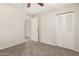 Carpeted bedroom featuring closet and adjacent bathroom at 9920 N 73Rd Ave, Peoria, AZ 85345