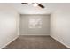 Inviting bedroom with neutral carpet, ceiling fan, and natural light from the window at 9920 N 73Rd Ave, Peoria, AZ 85345
