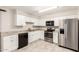 Modern kitchen with stainless steel appliances, sleek cabinets, and durable countertops at 9920 N 73Rd Ave, Peoria, AZ 85345