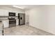 Bright kitchen featuring stainless steel appliances, ample counter space, and tile flooring at 9920 N 73Rd Ave, Peoria, AZ 85345