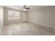 The living room boasts tile floors and a ceiling fan for added comfort at 9920 N 73Rd Ave, Peoria, AZ 85345